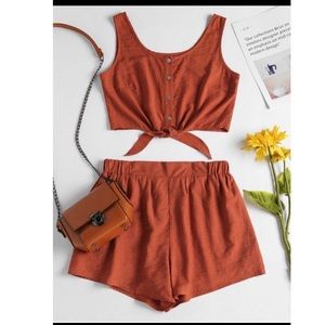 orange sleeveless button up crop top and short set